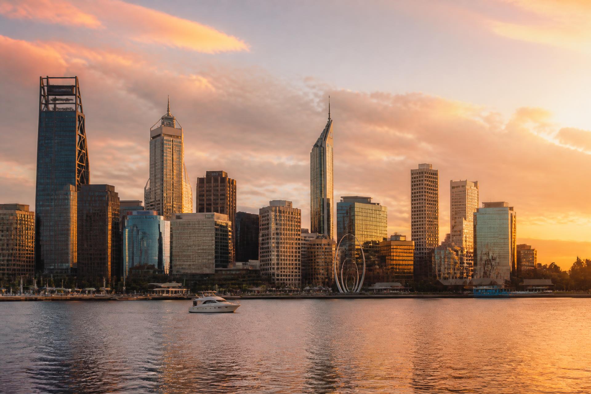 Perth city skyline over the Swan River at golden hour